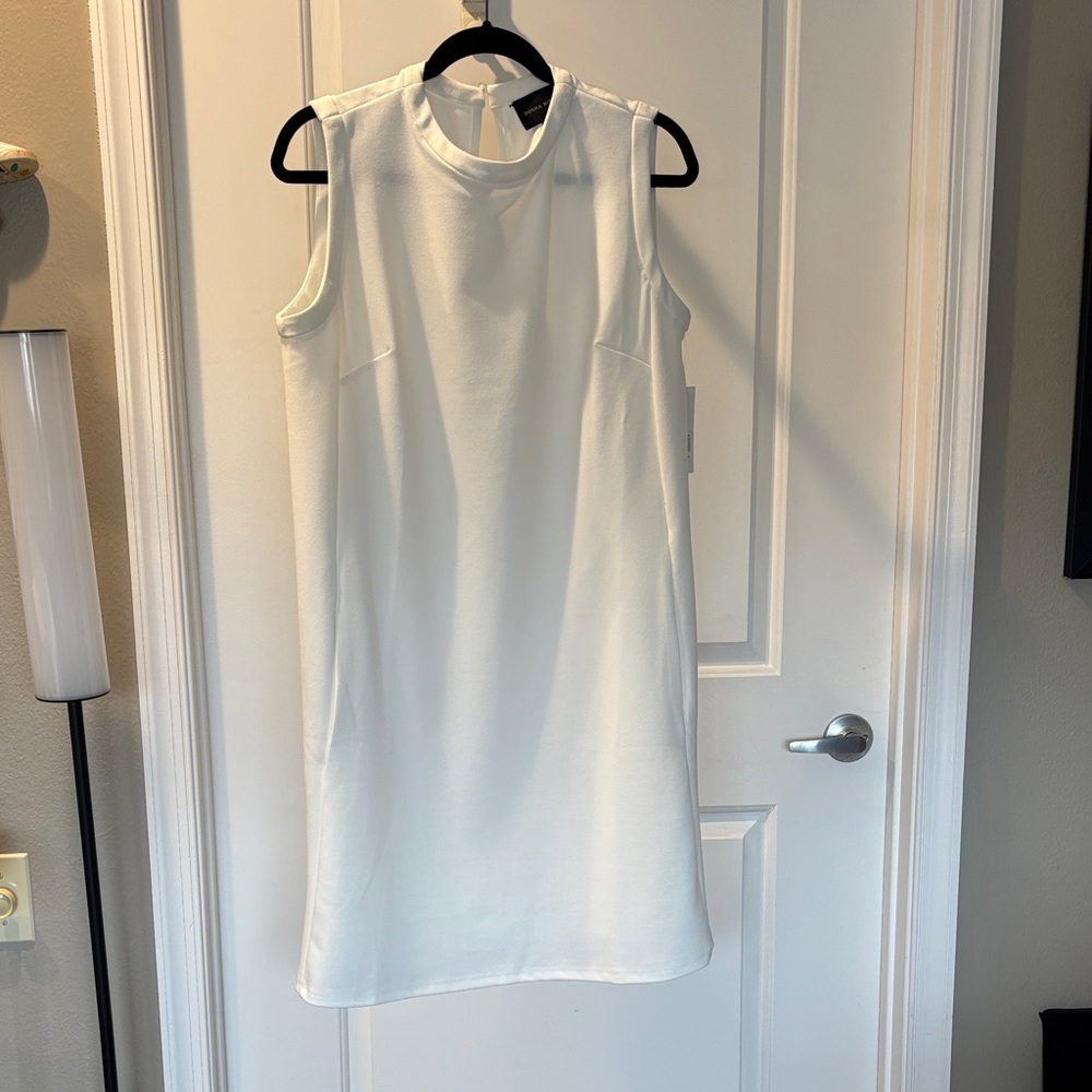 Donna Morgan Classic White Dress with side pockets.